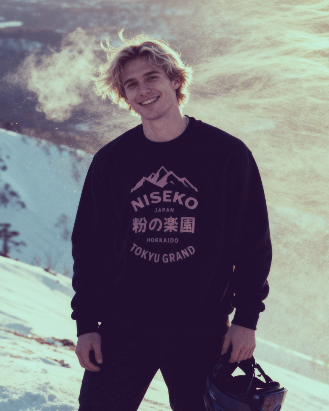 NISEKO POWDER PARADISE HEAVY SWEATER featuring mountains and Japanese text on a black sweatshirt.