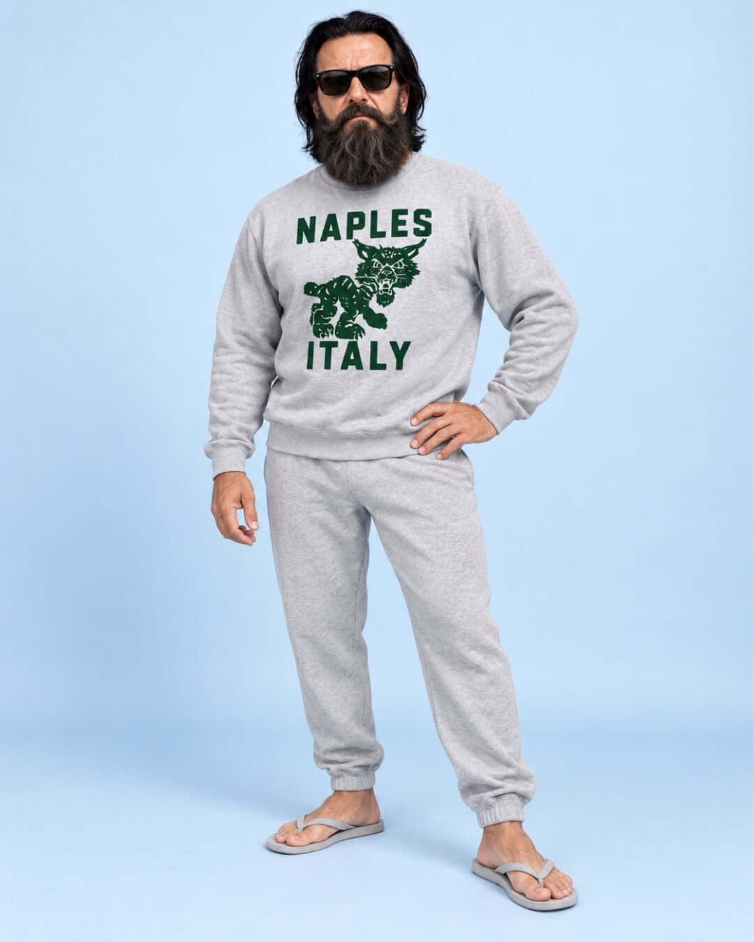 	Walter wearing the Sport Grey Naples Wildcat Soft Sweater with forest green graphic and grey joggers