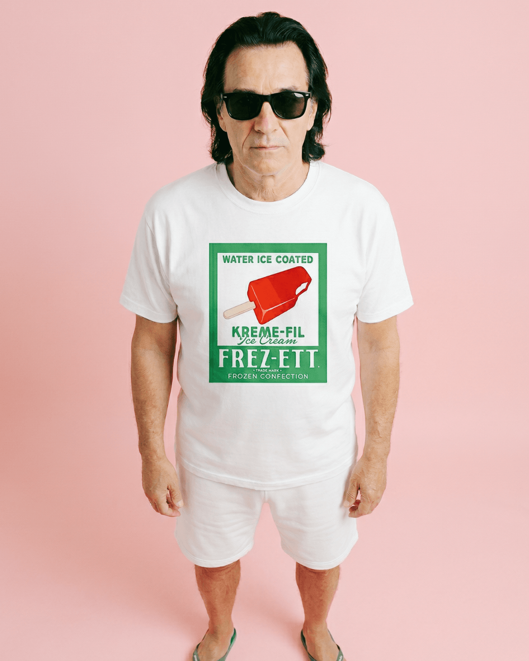 Model wearing a white shirt featuring vintage popsicle graphic, showcasing the POPSICLE T-SHIRT | VINTAGE AMERICANA POP-ART.