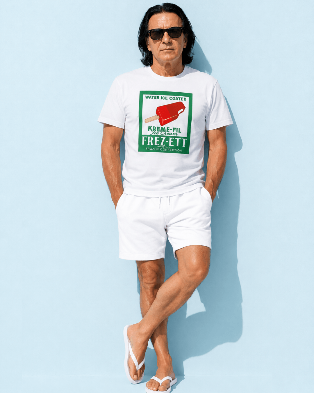 Popsicle T-Shirt | Vintage Americana Pop-art worn by a man in shorts and sunglasses against a light blue background.
