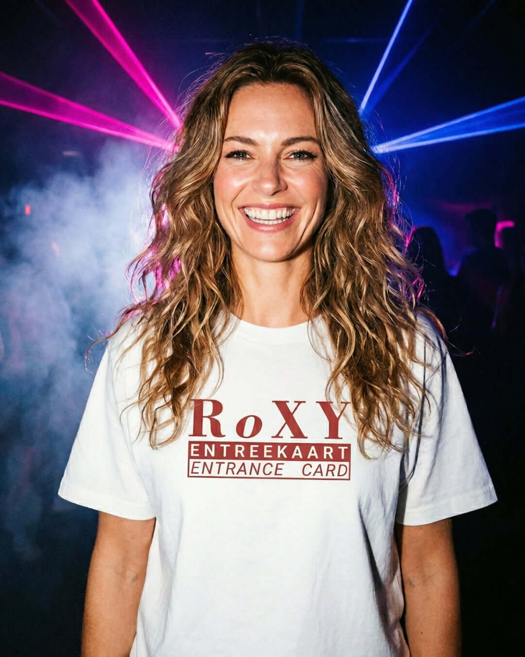Woman wearing a Roxy Nightclub T-shirt | Amsterdam House Legend surrounded by colorful lights.