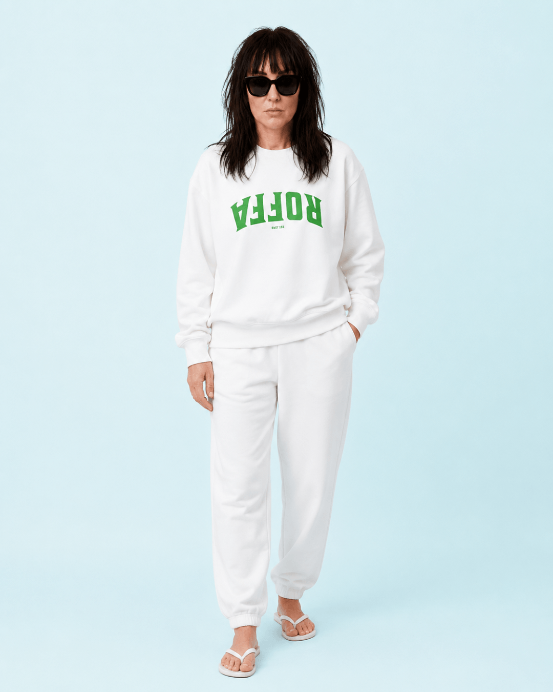 Roffa 1340 Heavy Sweater modeled by a woman in white with green text against a blue background.