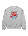 Saalbach Ski Team Heavy Sweater featuring a vintage ski team graphic on a gray background.