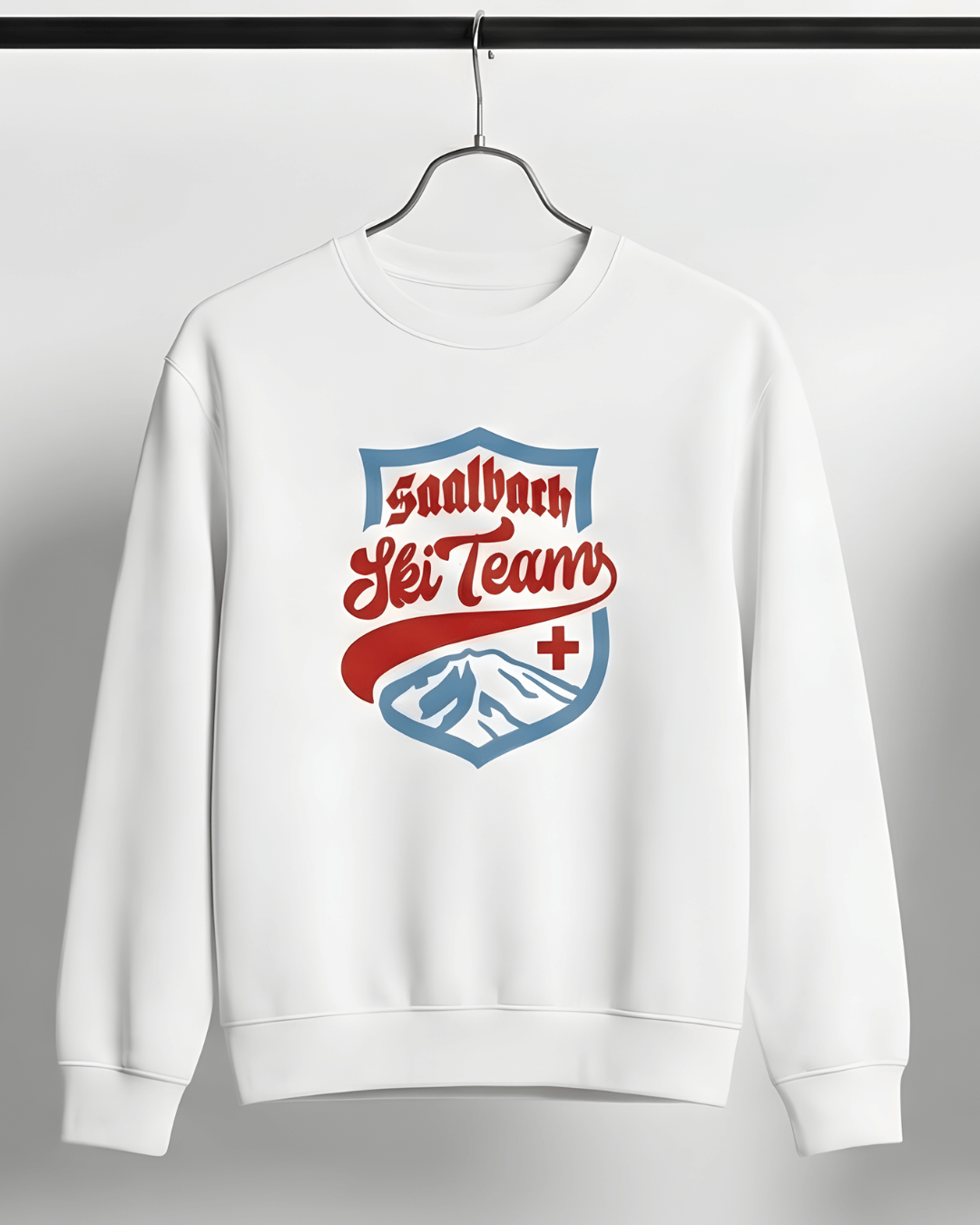 Saalbach Ski Team Heavy Sweater with vintage ski team graphic on white fabric.