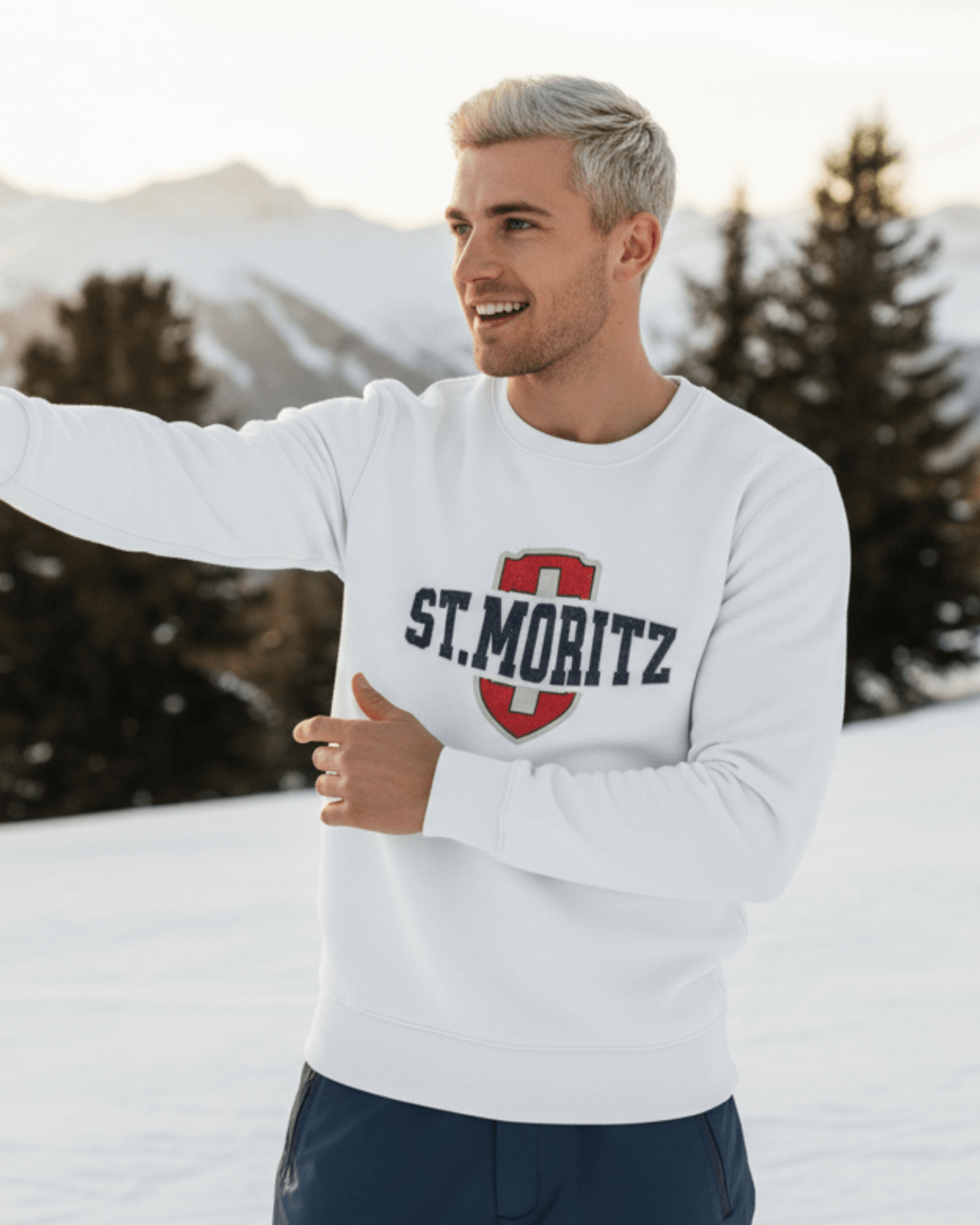 Man wearing ST. MORITZ HEAVY SWEATER in snowy landscape, showcasing Swiss alpine style and winter Olympics heritage.