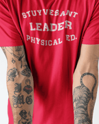 STUYVESANT PHYSICAL T-SHIRT worn by models showcasing hip hop style, featuring bold text and intricate tattoos.Camiseta Beastie Boys