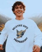 Young man wearing VALKYRIE GATE HEAVY SWEATER with winged emblem outdoors.